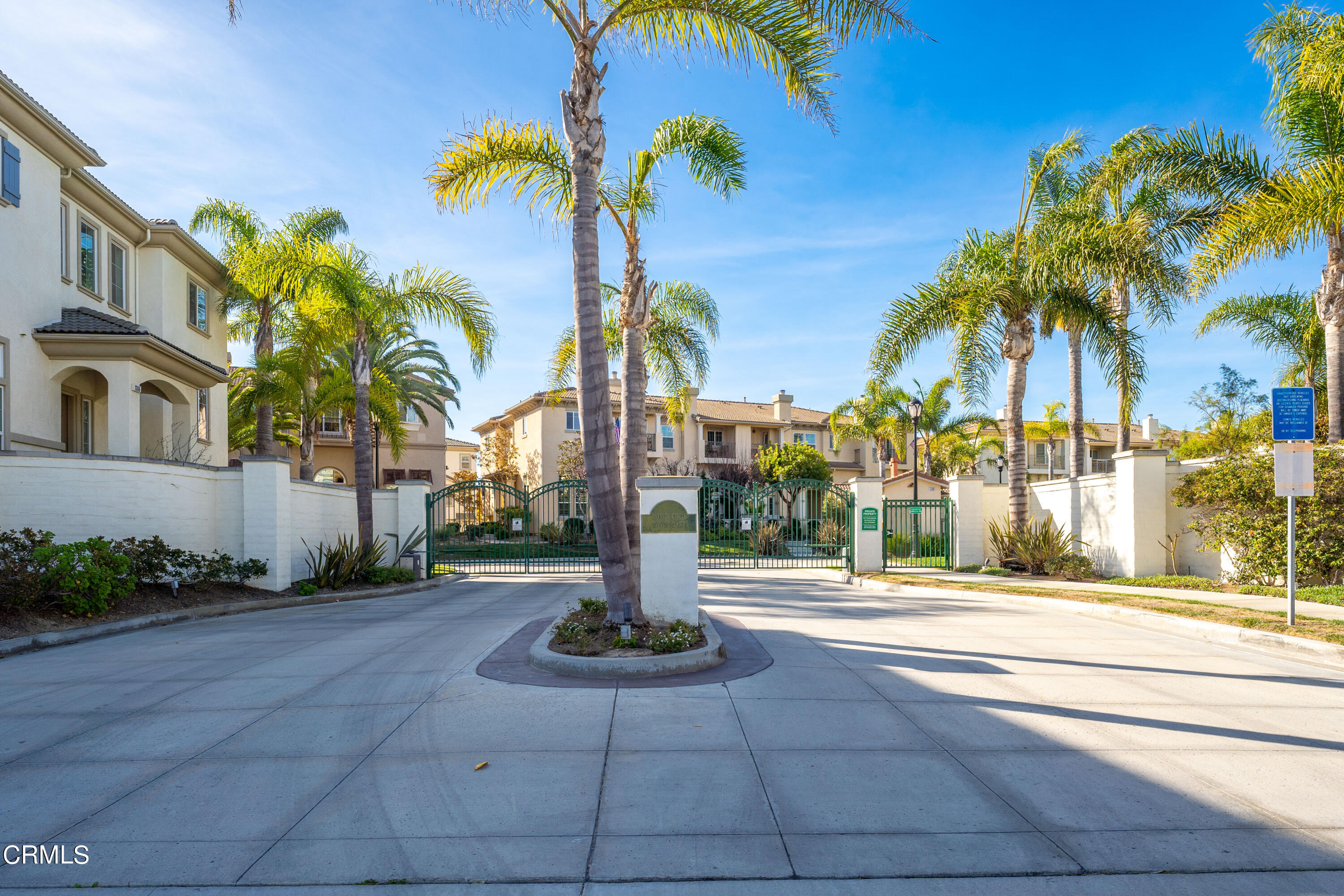 1239 Bayside Lane Oxnard, CA 93035 - Photo 25 of 27 a street view with palm trees