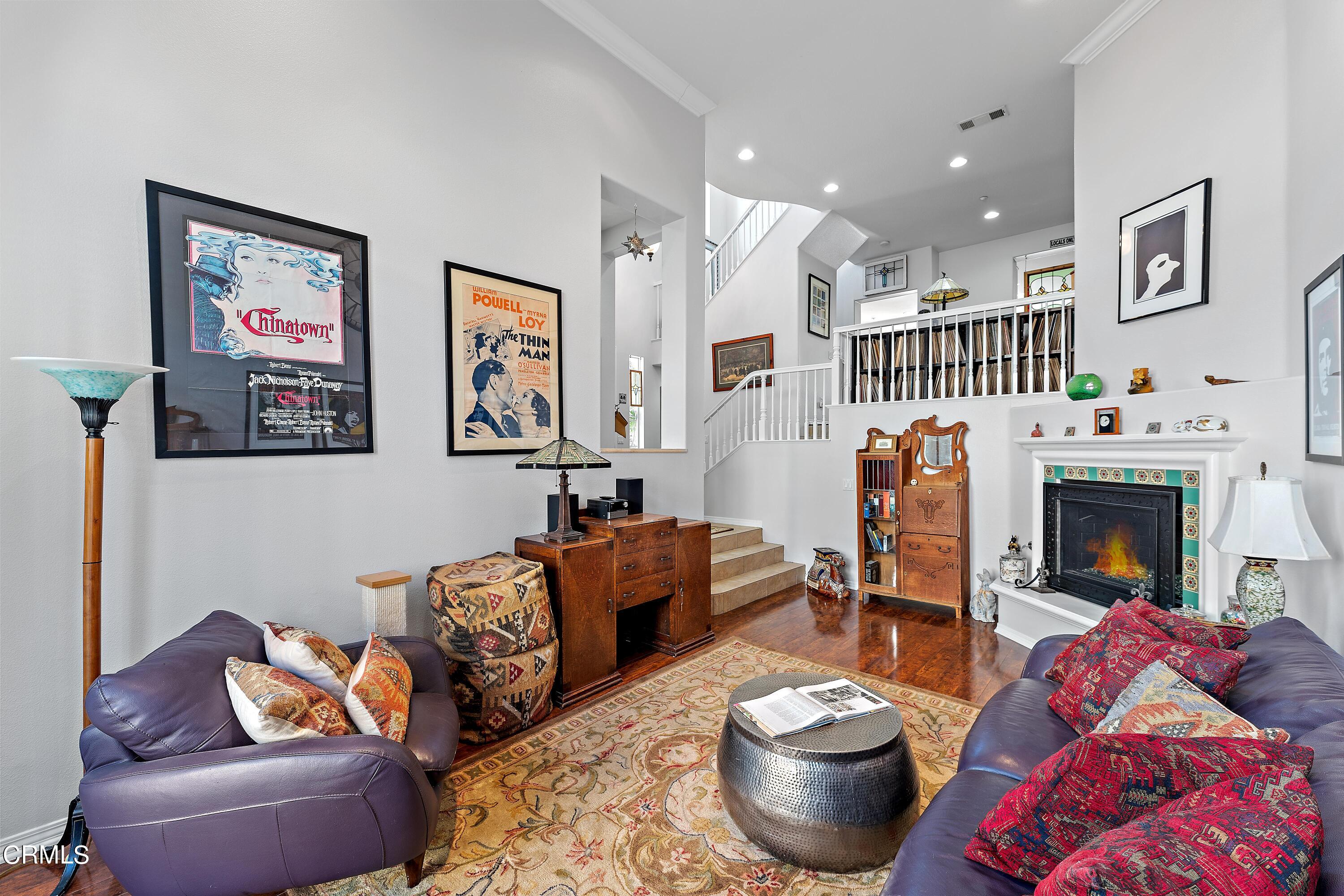 1239 Bayside Lane Oxnard, CA 93035 - Photo 4 of 27 a living room with furniture and a fireplace