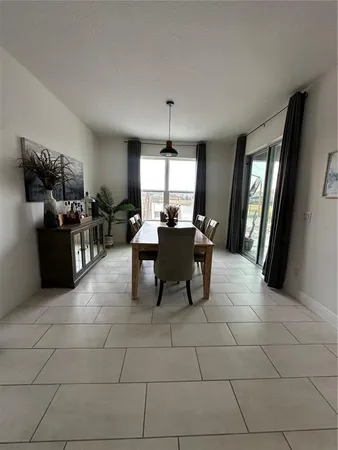 a dining room with furniture window wooden floor