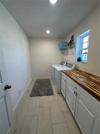 a bathroom with a glass door shower and a sink