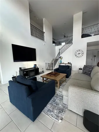a living room with furniture and a rug