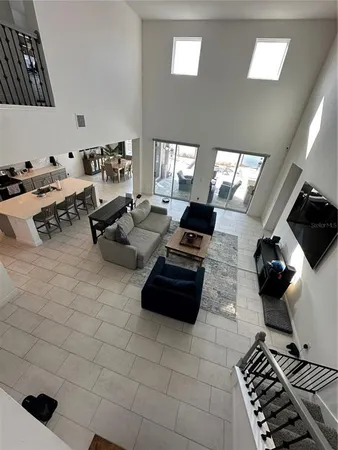 a view of a livingroom with furniture and staircase