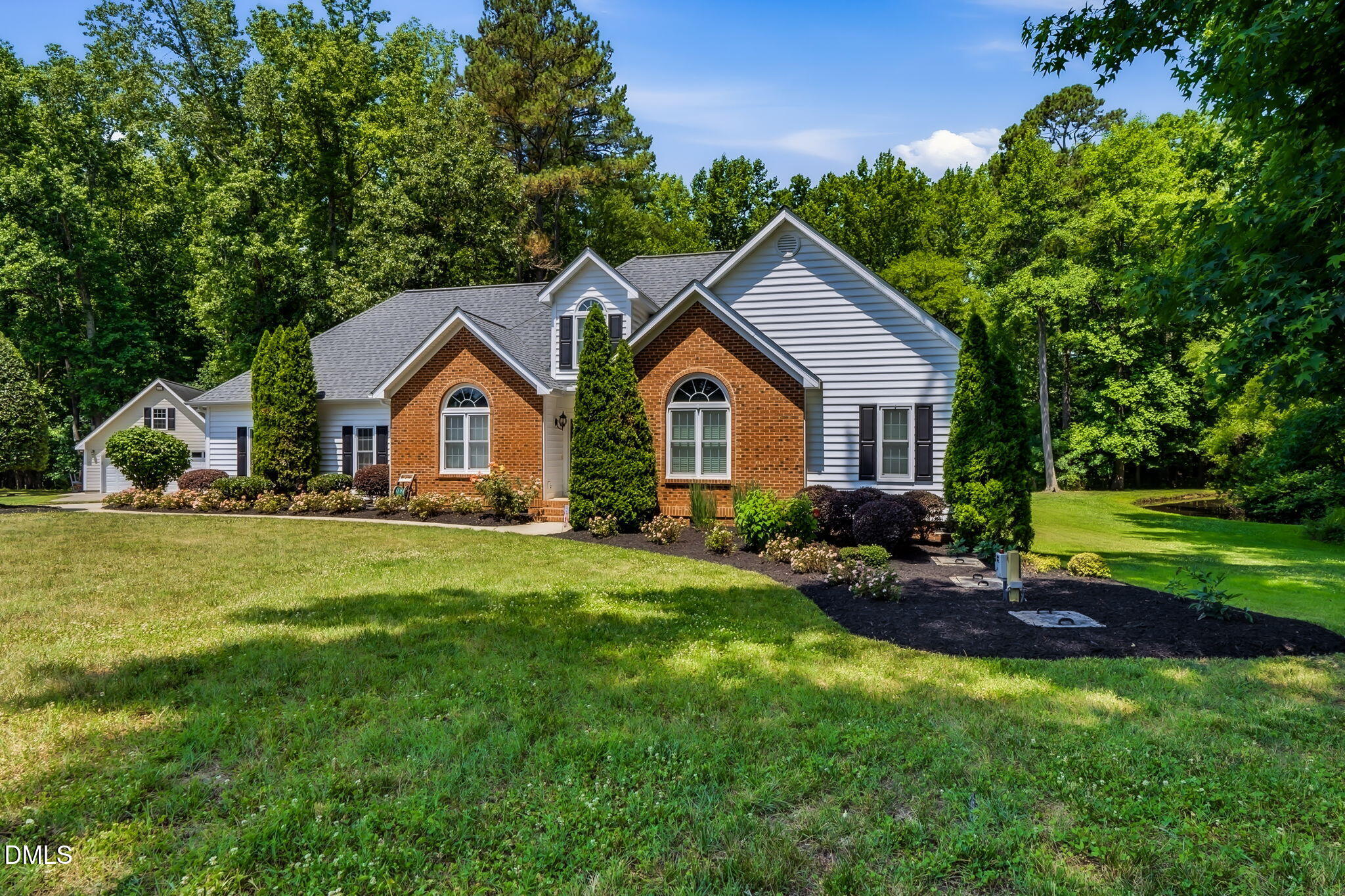 1112 Tyler Farms Drive Raleigh, NC 27603 - Photo 7 of 78 a front view of a house with garden