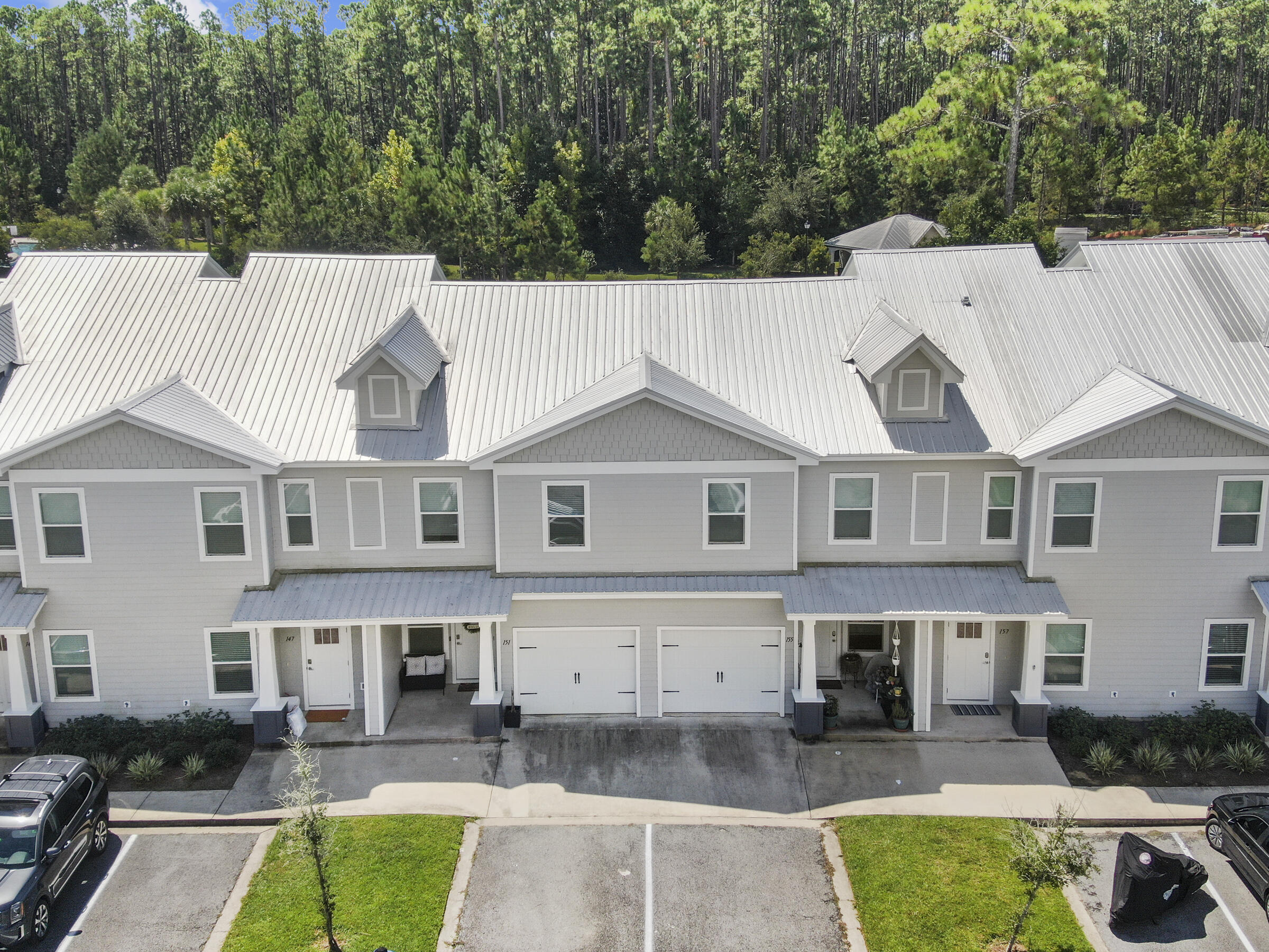 a aerial view of a house with swimming pool and furniture