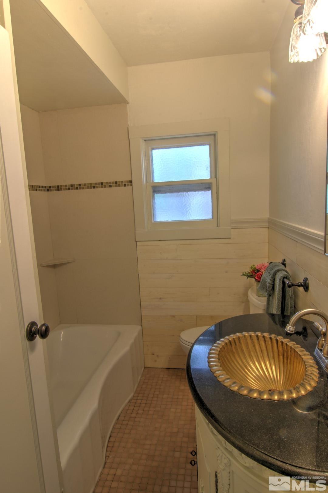 440 East 8th Street Reno, NV 89512 - Photo 12 of 23 a bathroom with a sink and a bath tub