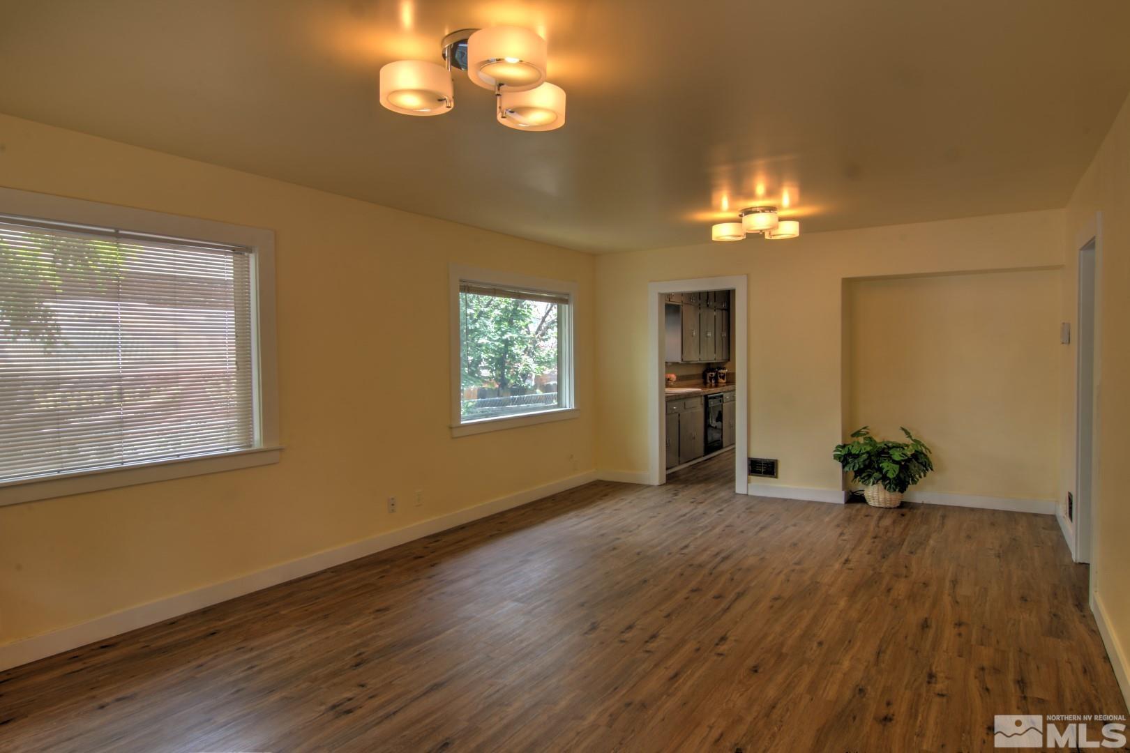440 East 8th Street Reno, NV 89512 - Photo 2 of 23 wooden floor in an empty room with a window