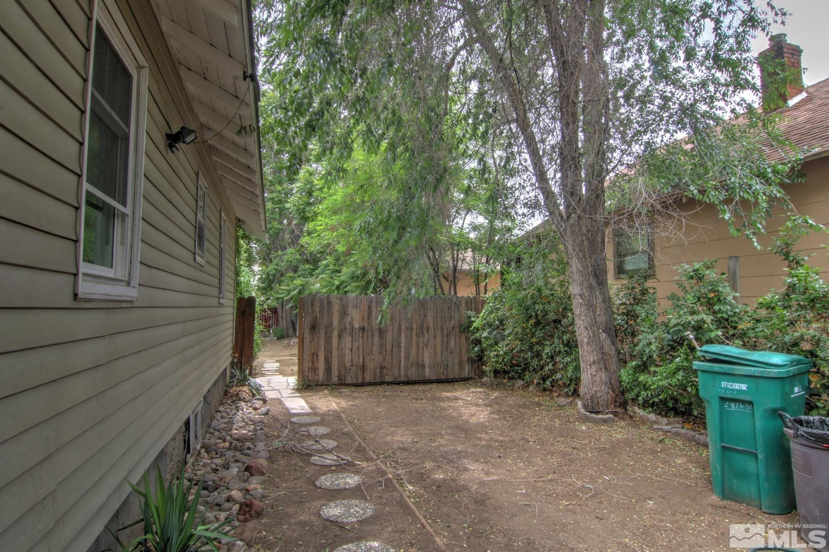 440 East 8th Street Reno, NV 89512 - Photo 22 of 23 a view of backyard with potted plants and large tree