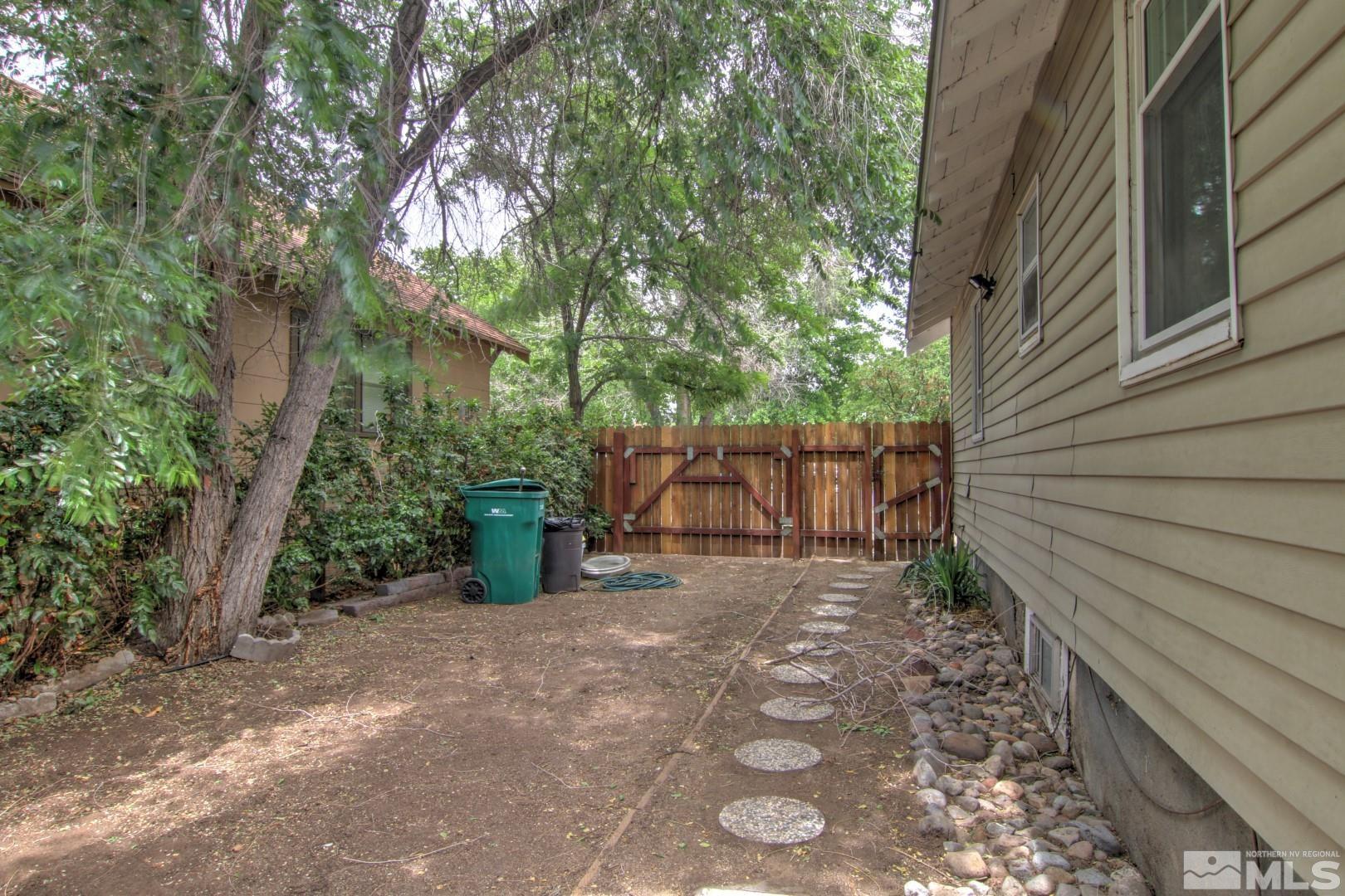 440 East 8th Street Reno, NV 89512 - Photo 23 of 23 a view of a room with a tree and wooden fence