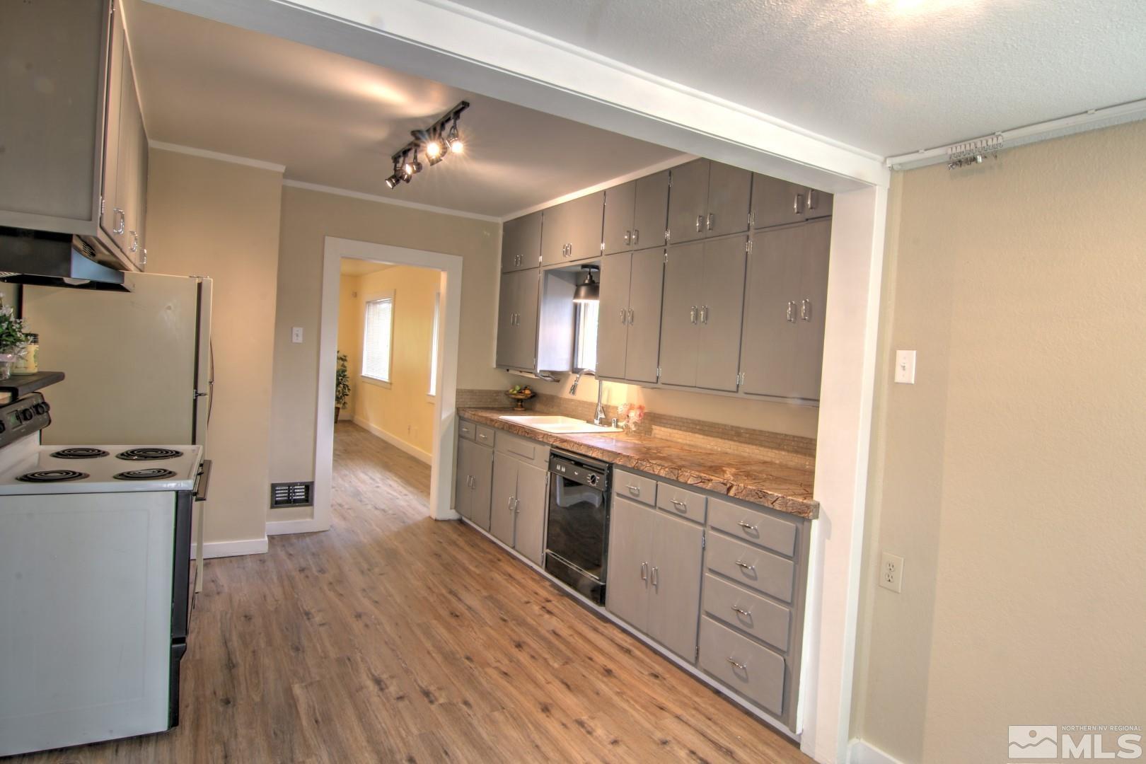 440 East 8th Street Reno, NV 89512 - Photo 6 of 23 a large kitchen with a lot of counter space and wooden floor