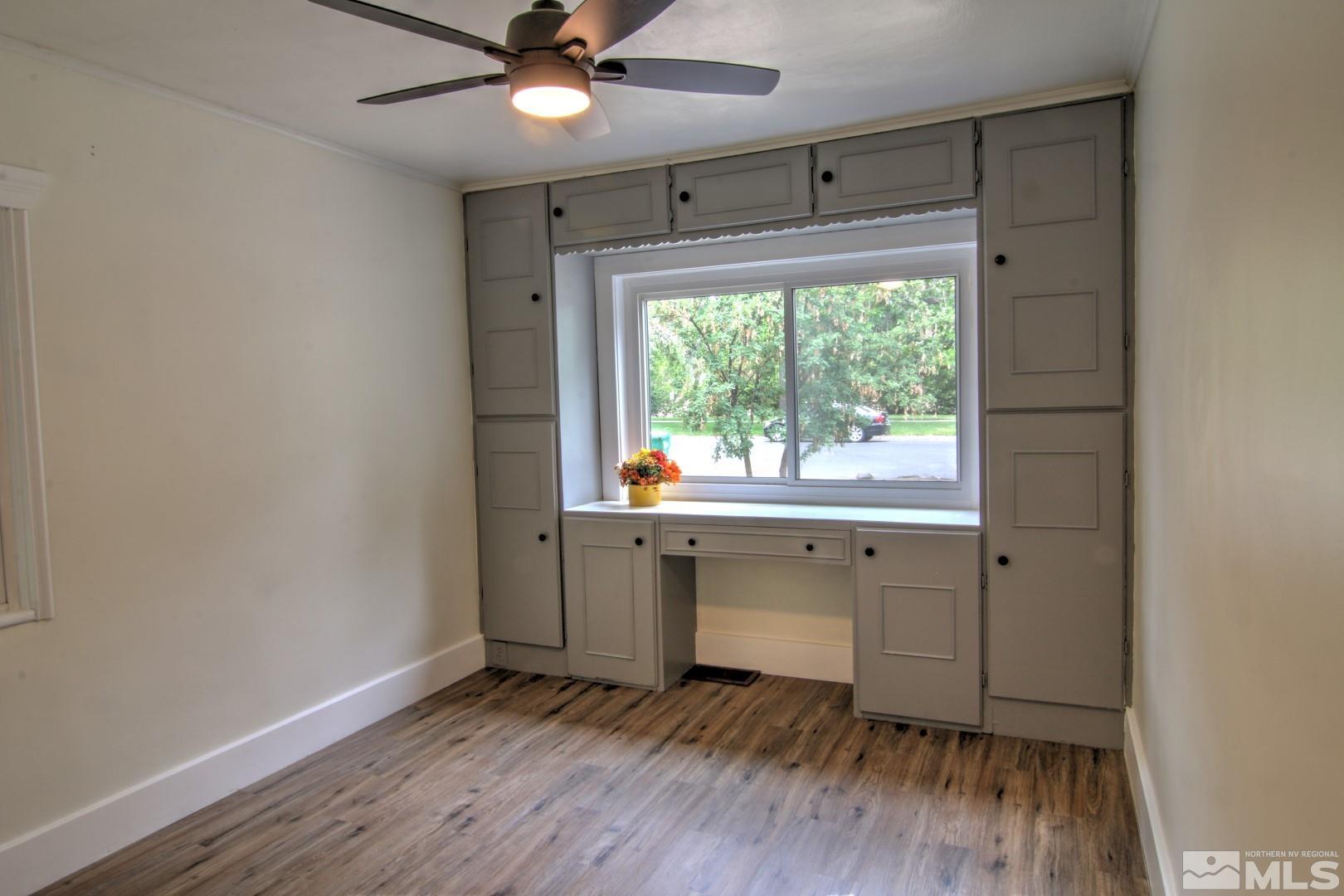 440 East 8th Street Reno, NV 89512 - Photo 9 of 23 a view of an empty room with a window and wooden floor
