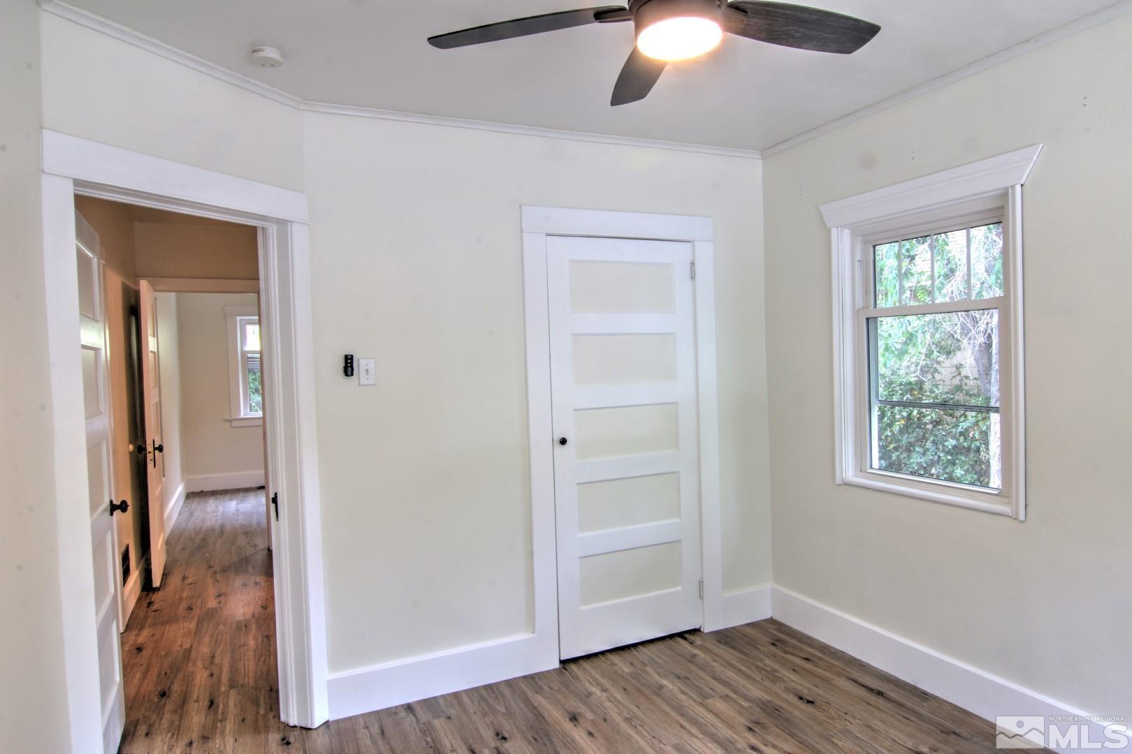 440 East 8th Street Reno, NV 89512 - Photo 10 of 23 wooden floor in an empty room with a window