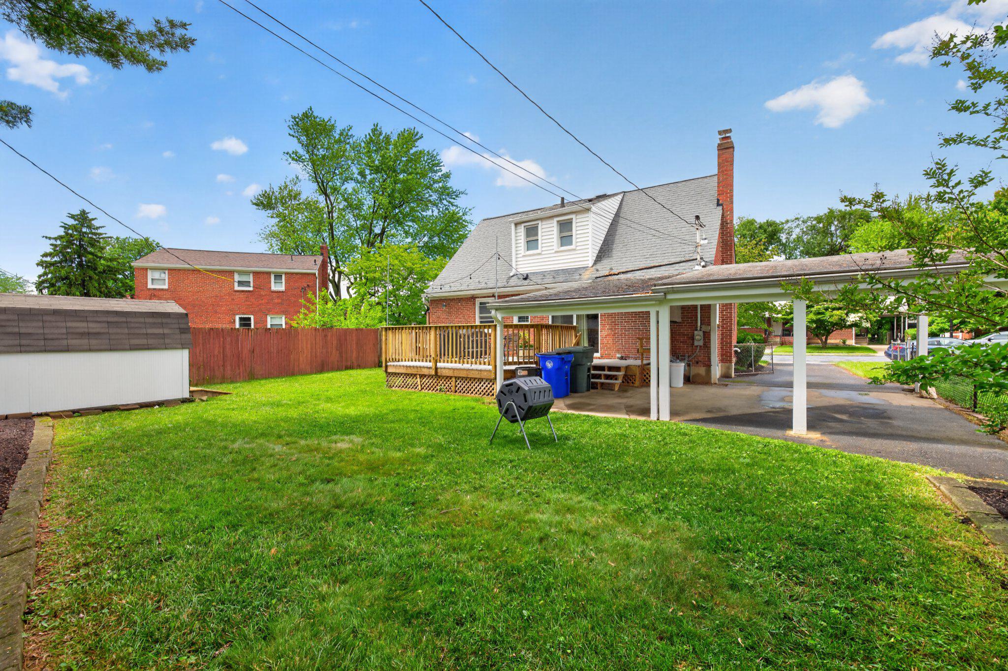 1002 Wilson Place Frederick, MD 21702 - Photo 10 of 30 a view of a yard with table and chairs potted plants and a palm tree