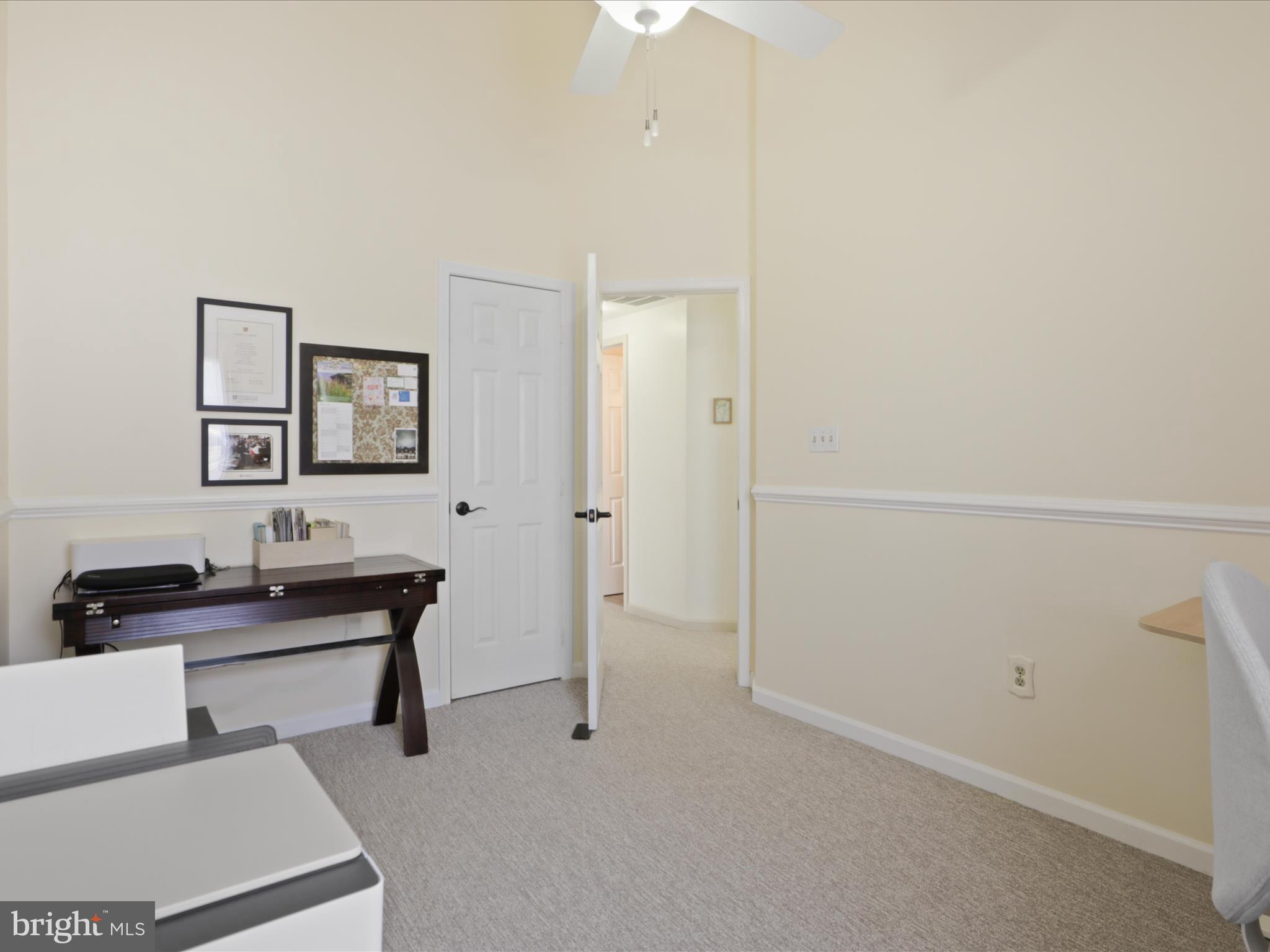 3906 Elbert Avenue Alexandria, VA 22305 - Photo 22 of 40 a view of a workspace with furniture and a bathroom