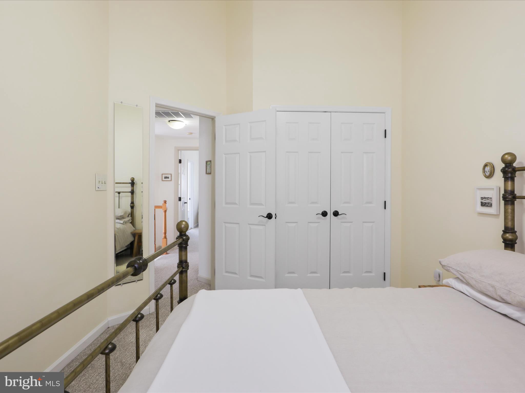 3906 Elbert Avenue Alexandria, VA 22305 - Photo 24 of 40 a bedroom with a bed and a flat screen tv