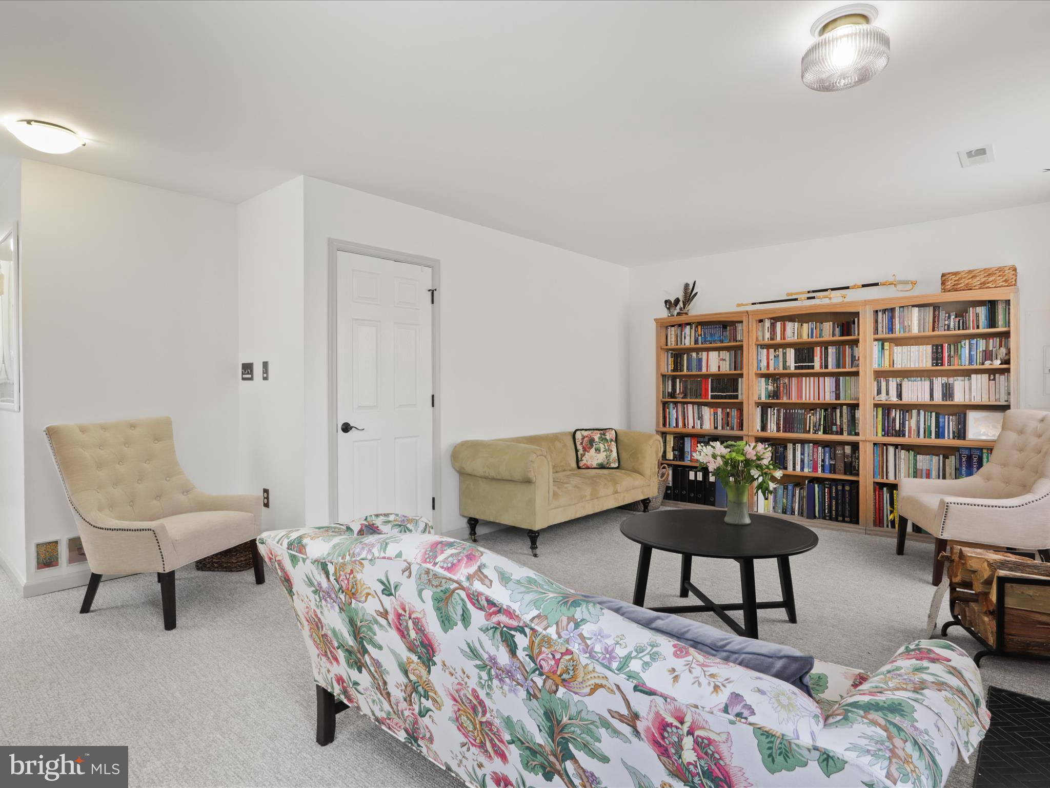 3906 Elbert Avenue Alexandria, VA 22305 - Photo 28 of 40 a living room with furniture and a book shelf