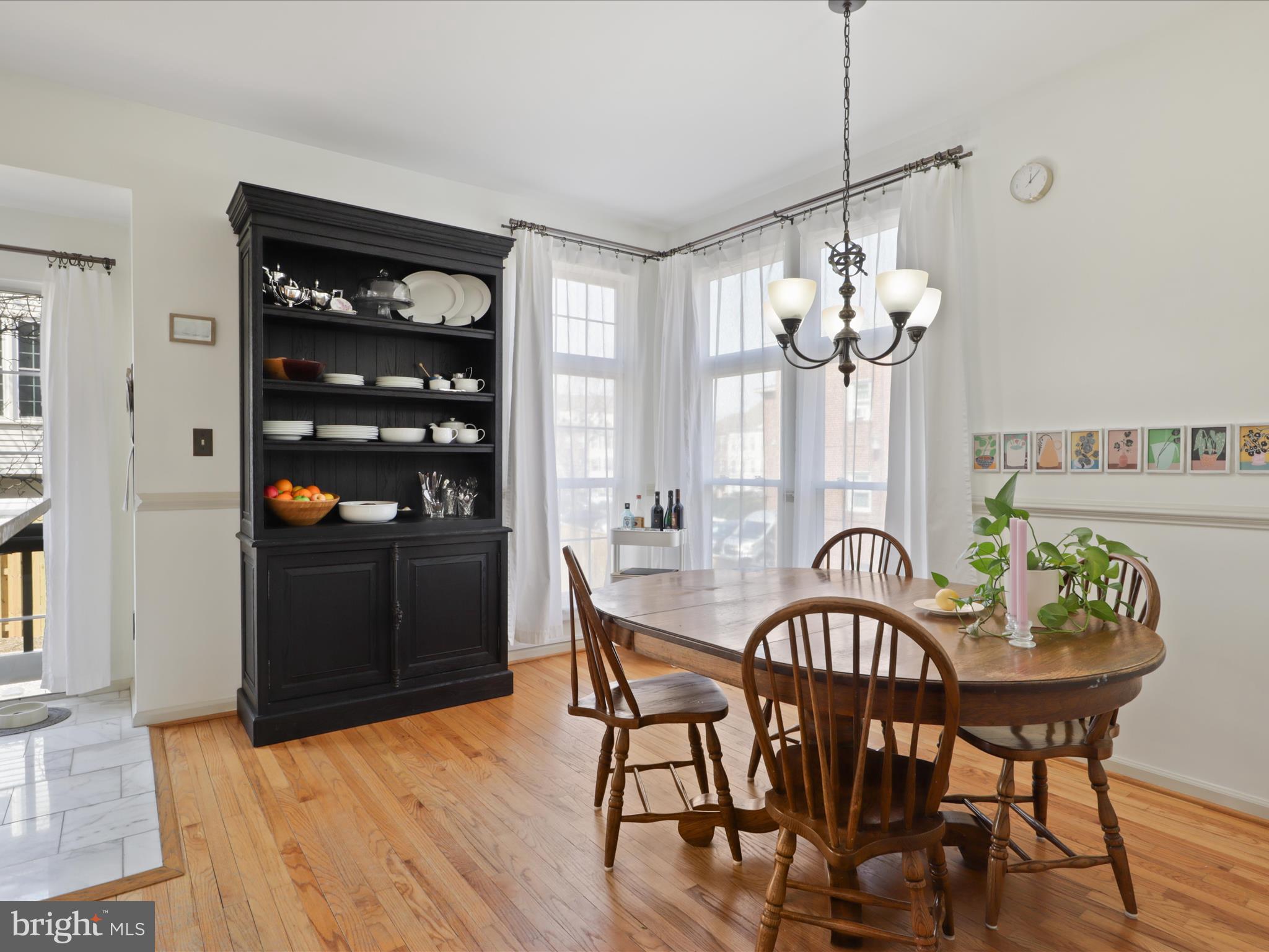 3906 Elbert Avenue Alexandria, VA 22305 - Photo 9 of 40 a view of a dining room with furniture wooden floor and chandelier
