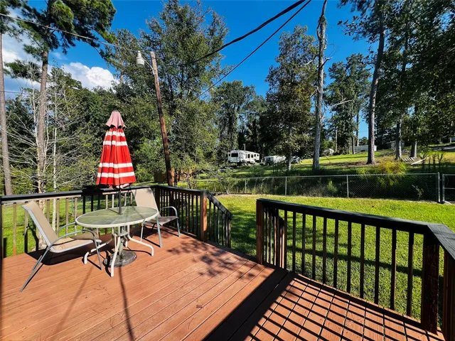 a view of a patio with a table chairs and a table