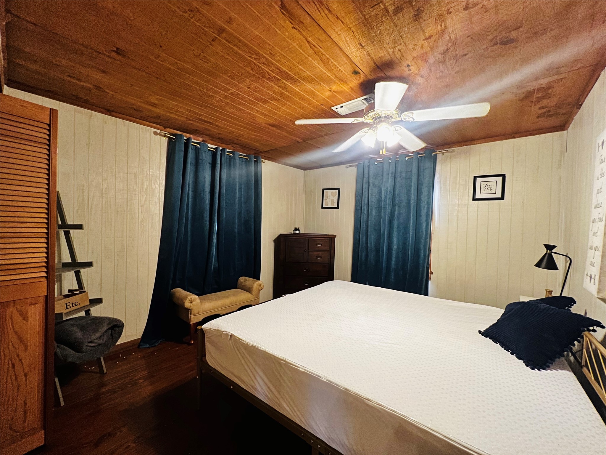 523 Beechridge Loop Hemphill, TX 75948 - Photo 9 of 18 a bedroom with a bed and a chandelier