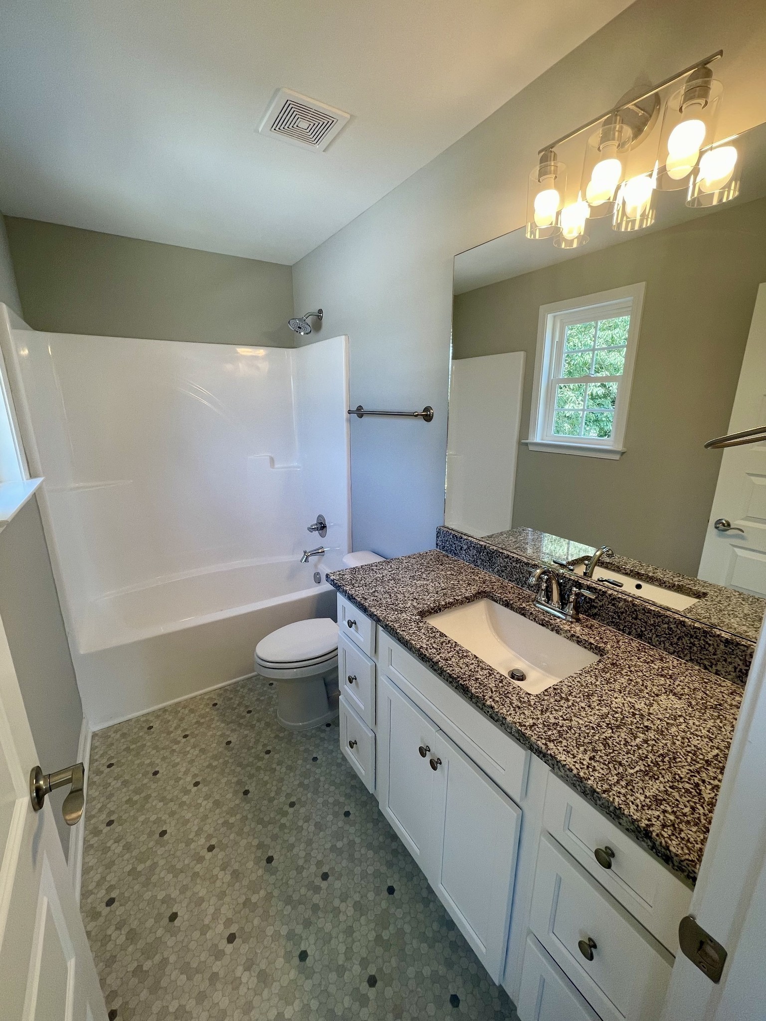 208 Power Avenue, Unit D Murfreesboro, TN 37129 - Photo 14 of 14 a bathroom with a granite countertop sink toilet and shower
