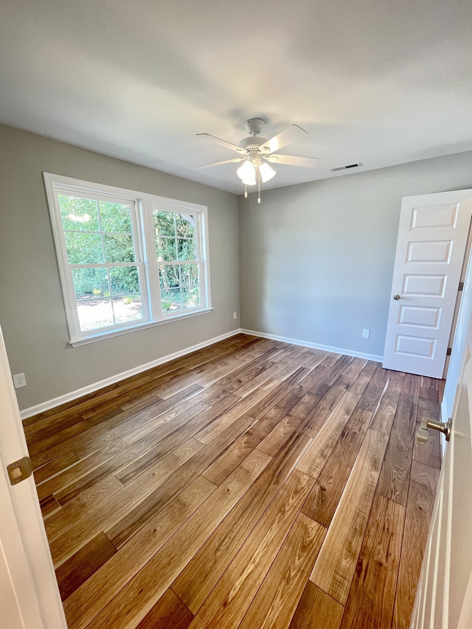 208 Power Avenue, Unit D Murfreesboro, TN 37129 - Photo 6 of 14 a view of empty room with window and ceiling fan