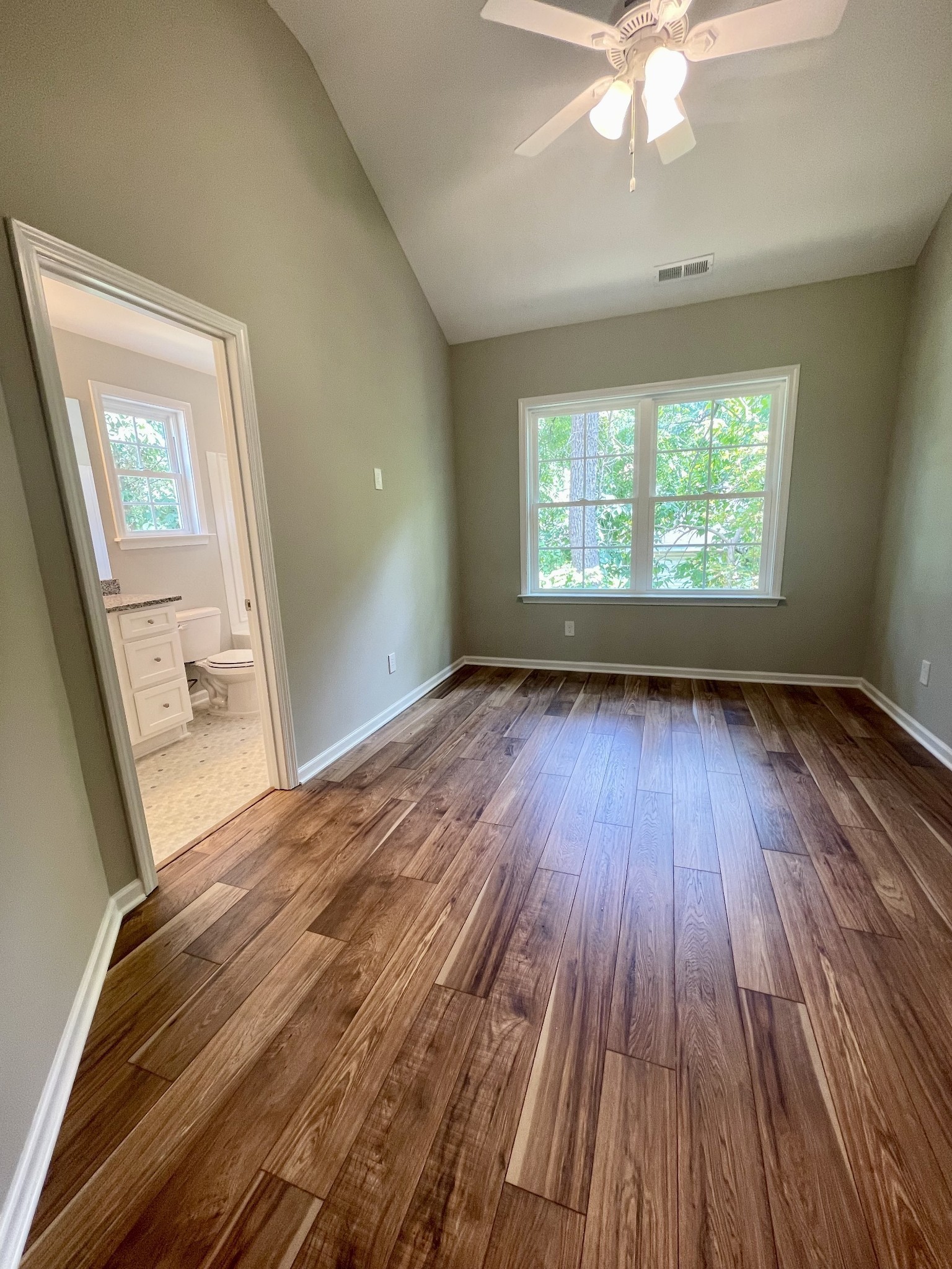208 Power Avenue, Unit D Murfreesboro, TN 37129 - Photo 10 of 14 wooden floor in an empty room with a window