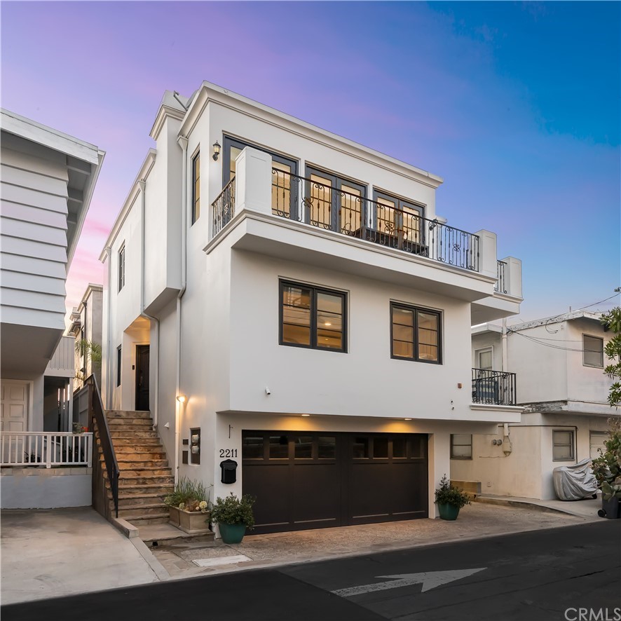 a front view of a house with a garage