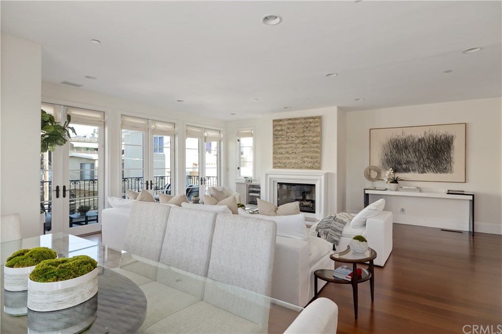 2211 Vista Drive Manhattan Beach, CA 90266 - Photo 14 of 48 a living room with furniture a fireplace and a potted plant