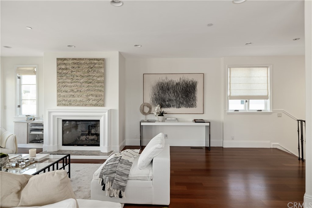 2211 Vista Drive Manhattan Beach, CA 90266 - Photo 15 of 48 a living room with furniture a fireplace and wooden floor