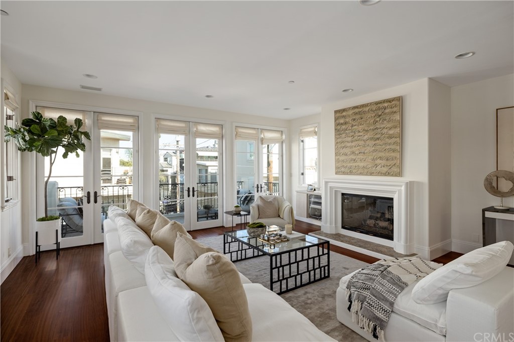 2211 Vista Drive Manhattan Beach, CA 90266 - Photo 16 of 48 a living room with furniture large window and a fireplace
