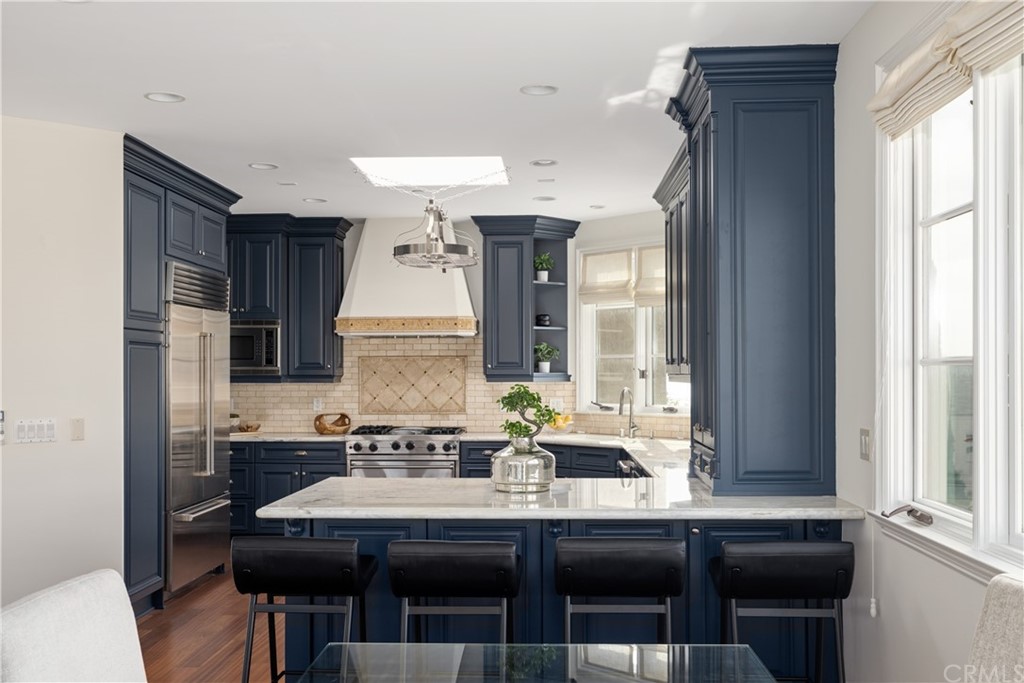 2211 Vista Drive Manhattan Beach, CA 90266 - Photo 25 of 48 a dining hall with stainless steel appliances granite countertop a dining table and chairs