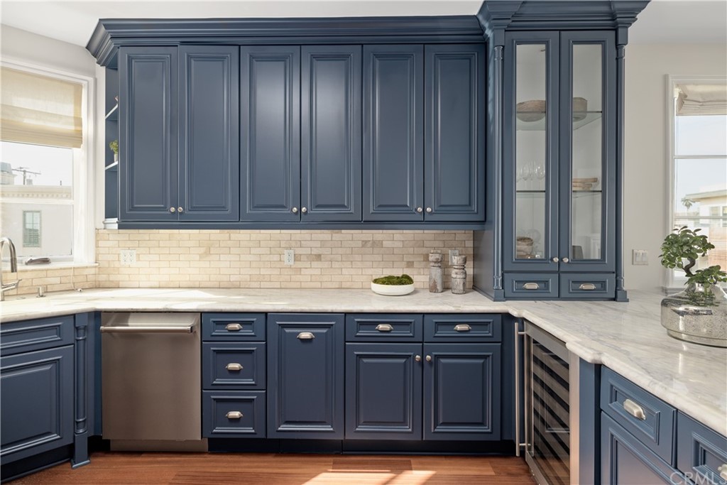 2211 Vista Drive Manhattan Beach, CA 90266 - Photo 26 of 48 a kitchen with granite countertop a sink and cabinets
