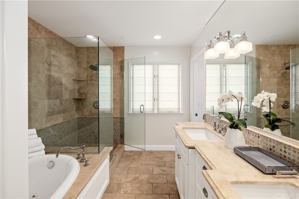 2211 Vista Drive Manhattan Beach, CA 90266 - Photo 37 of 48 a bathroom with a granite countertop sink mirror and a bathtub