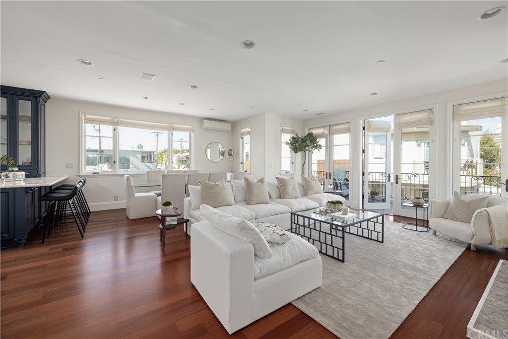2211 Vista Drive Manhattan Beach, CA 90266 - Photo 6 of 48 a living room with furniture wooden floor and a large window