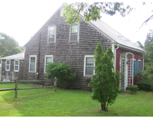 114 Upper County Road Dennis, MA 02660 - Photo 5 of 5 a front view of a house with a yard