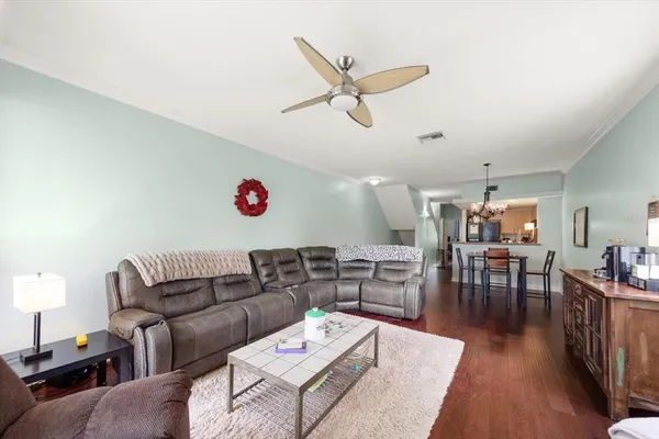a living room with furniture fireplace and flat screen tv