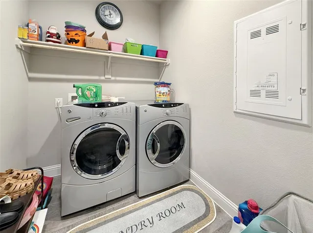 a utility room with dryer and washer