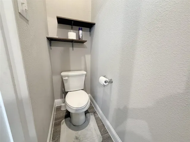 a bathroom with a tub a sink shower and mirror