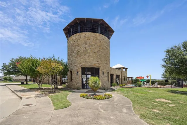 an aerial view of a house with swimming pool and outdoor space