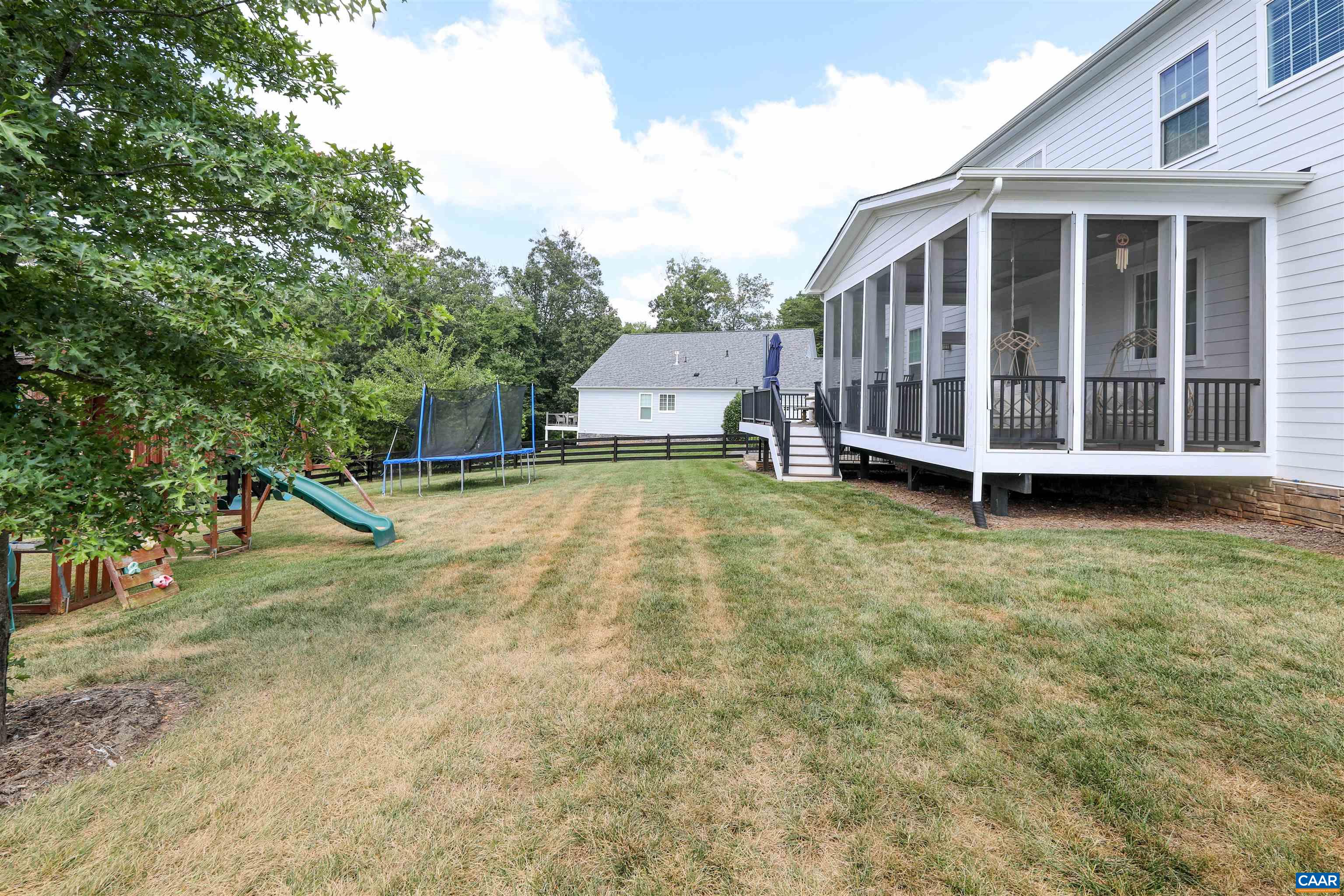 2483 Ferndown Lane Keswick, VA 22947 - Photo 49 of 54 a view of a house with a yard and sitting area