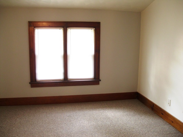 8720 Elva Road DeKalb, IL 60115 - Photo 10 of 25 an empty room with a window