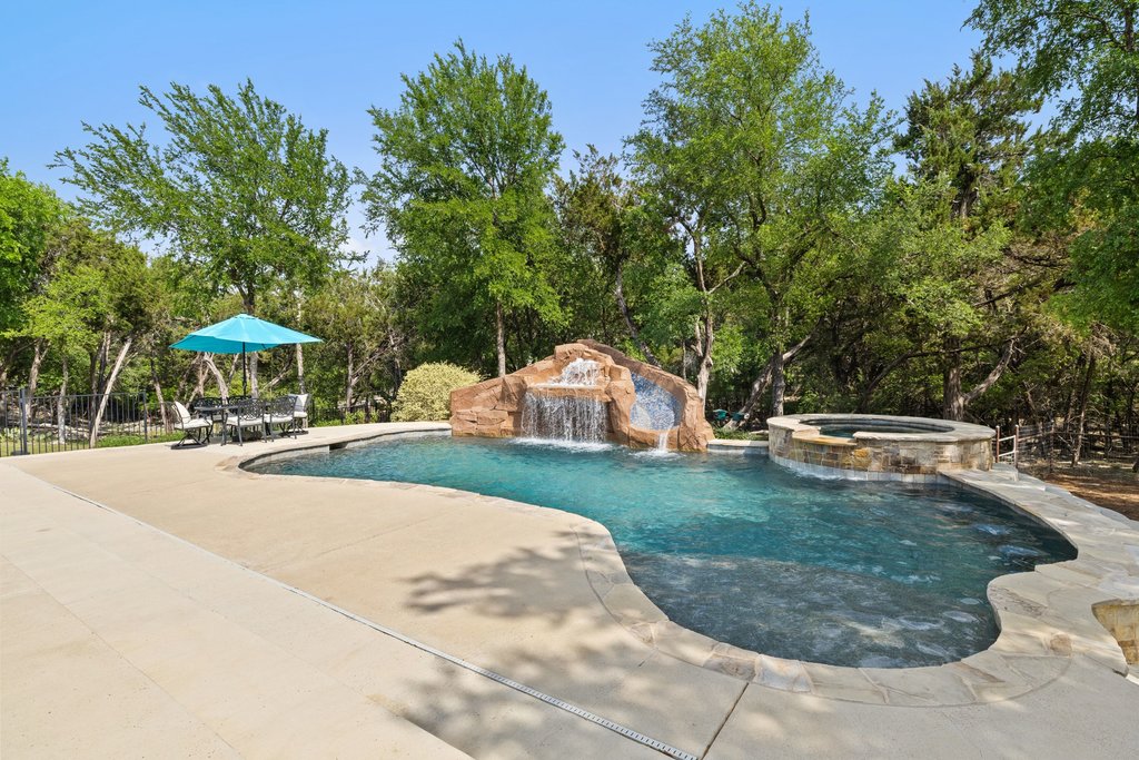 108 Berry Cove Georgetown, TX 78628 - Photo 36 of 39 a view of a table and chairs in the backyard