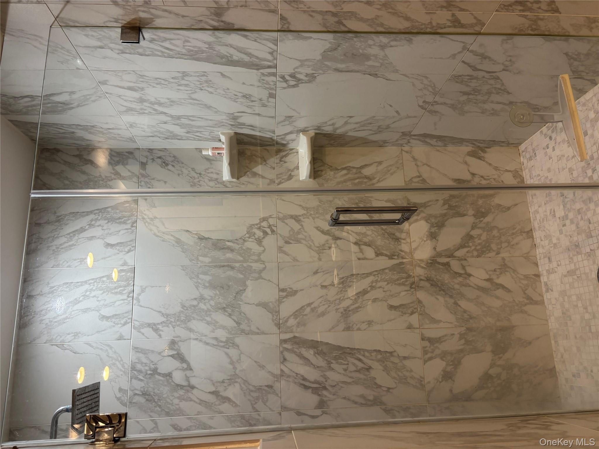 2 Richmond Road, Unit 1K Lido Beach, NY 11561 - Photo 13 of 18 a bathroom with a shower