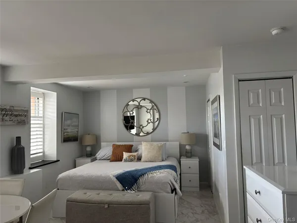 a living room with furniture a window and a clock