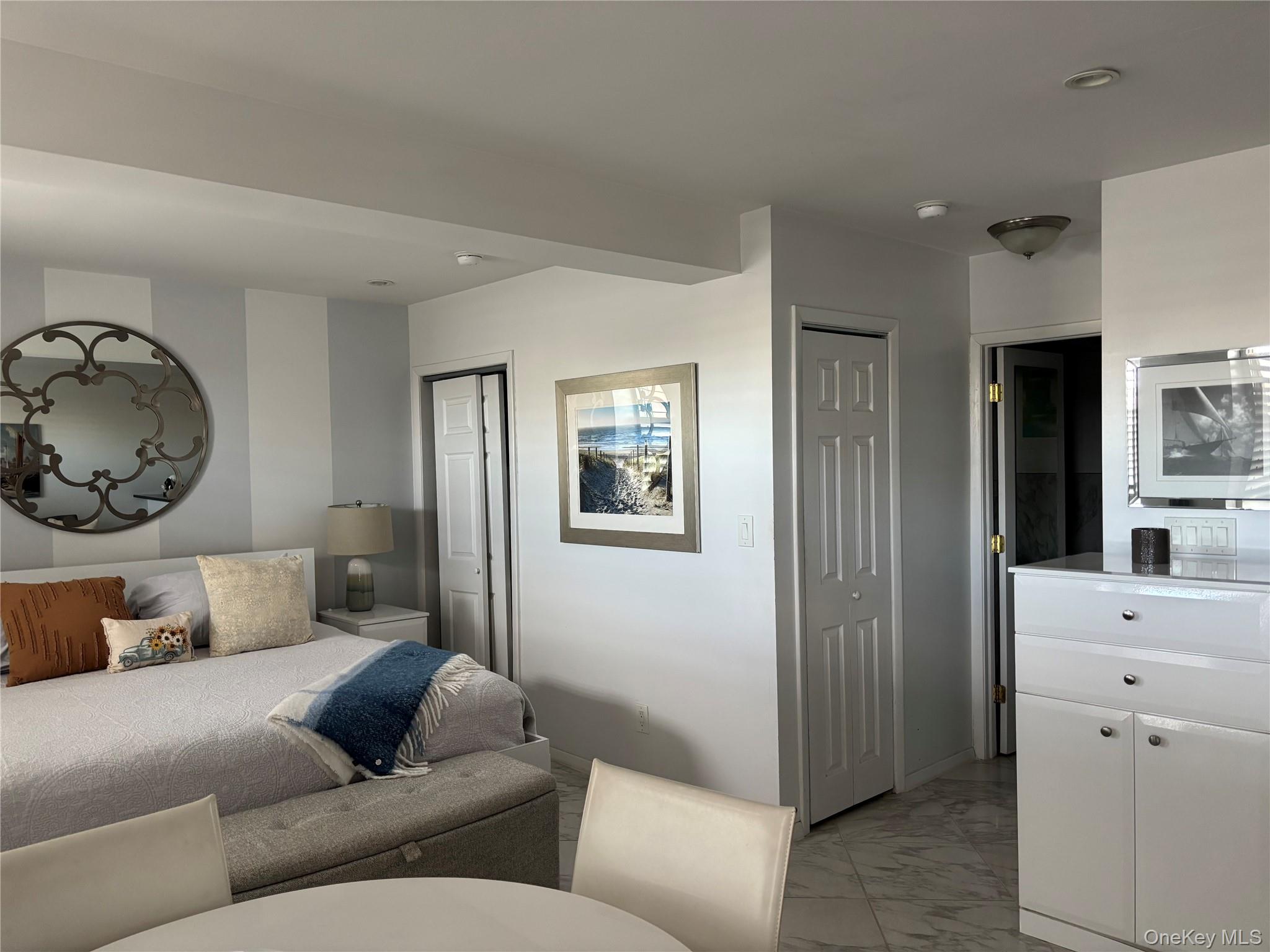 2 Richmond Road, Unit 1K Lido Beach, NY 11561 - Photo 4 of 18 a living room with furniture and a window