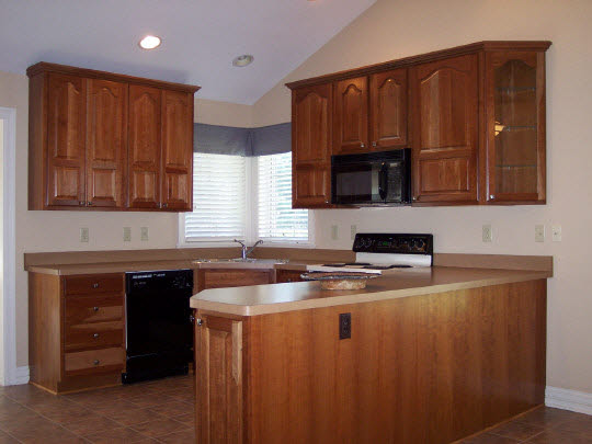 6807 Rote Road Rockford, IL 61107 - Photo 3 of 5 a kitchen with stainless steel appliances granite countertop a sink stove and microwave
