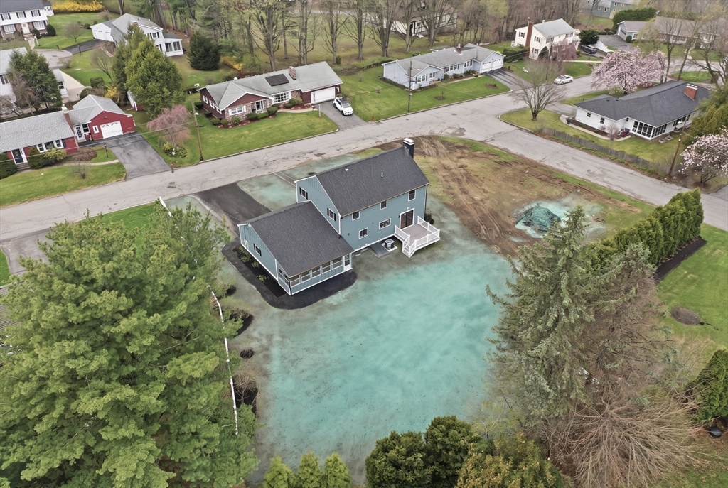 105 Stafford Road Lowell, MA 01852 - Photo 35 of 42 an aerial view of a house with a yard and lake view