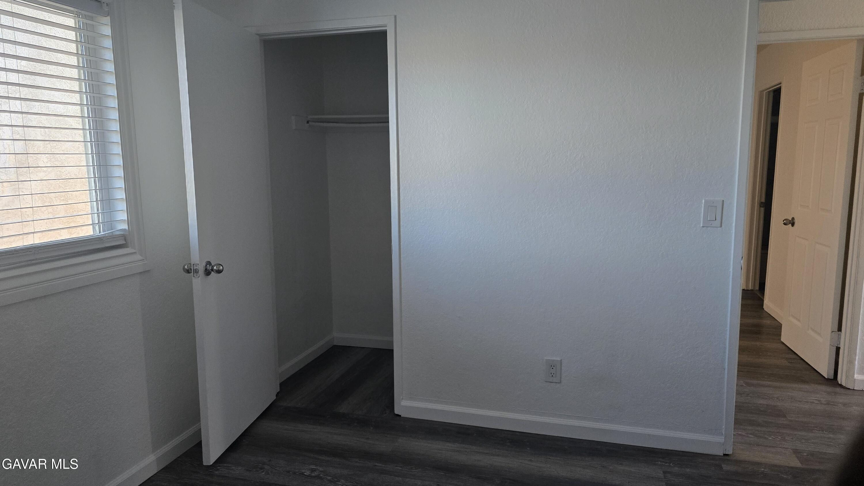 38551 10th Place East, Unit A Palmdale, CA 93550 - Photo 11 of 18 a view of closet area with wooden floor