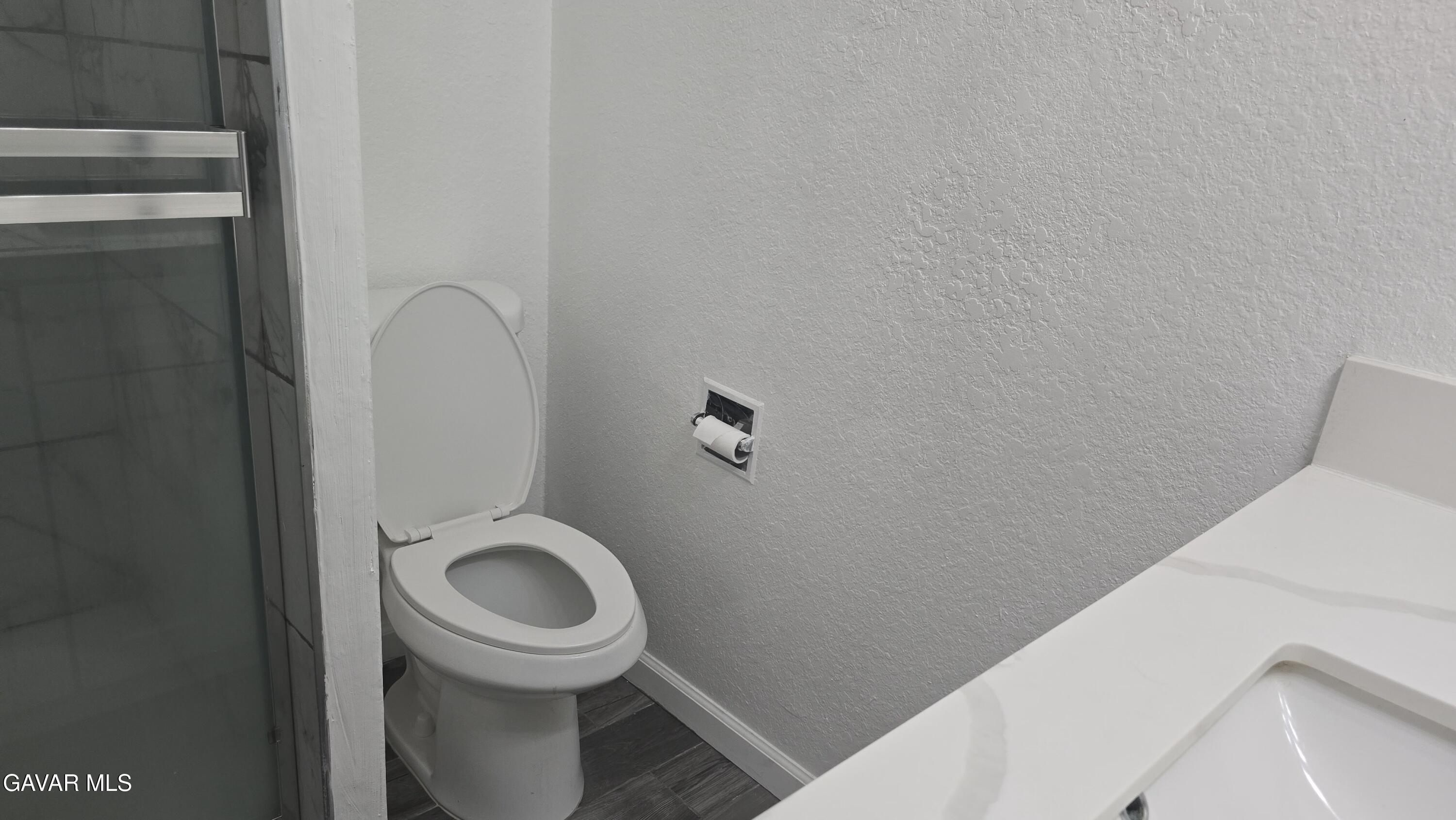 38551 10th Place East, Unit A Palmdale, CA 93550 - Photo 14 of 18 a bathroom with a toilet and a sink