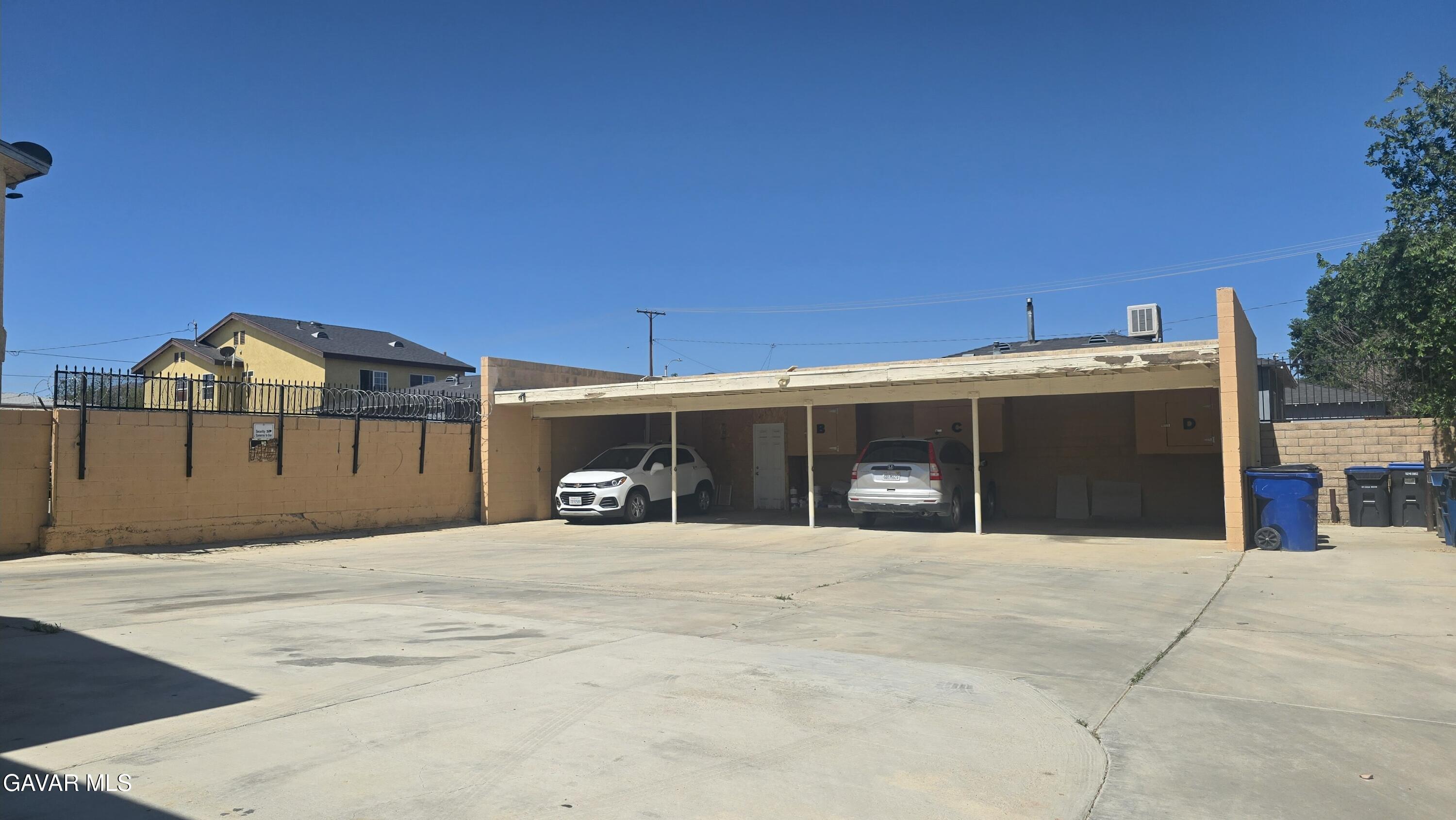 38551 10th Place East, Unit A Palmdale, CA 93550 - Photo 3 of 18 a front view of a house with a garage