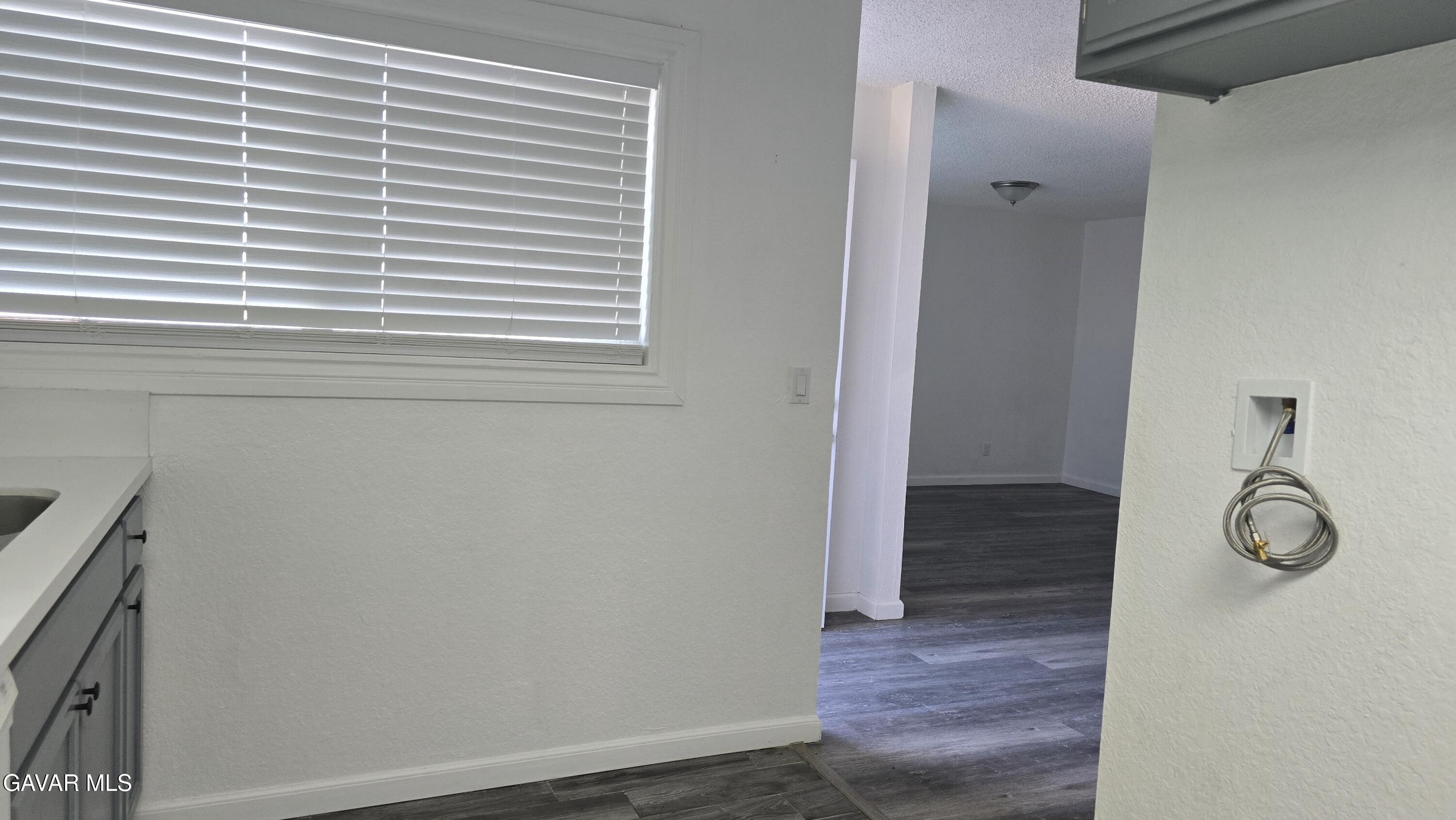 38551 10th Place East, Unit A Palmdale, CA 93550 - Photo 7 of 18 a view of entryway with wooden floor